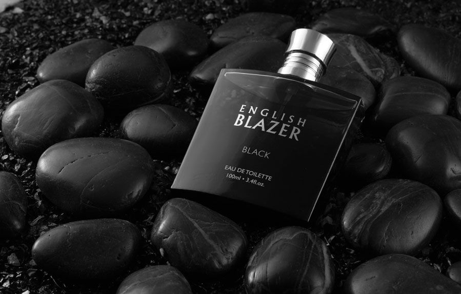 A black deodorant displayed attractively on black decorative stones