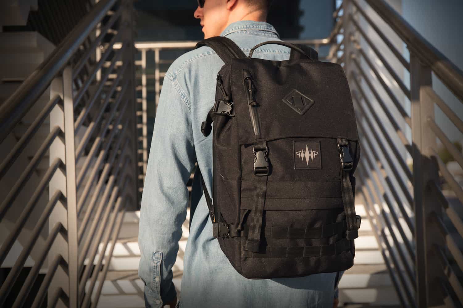 A man back shot wearing a black bag